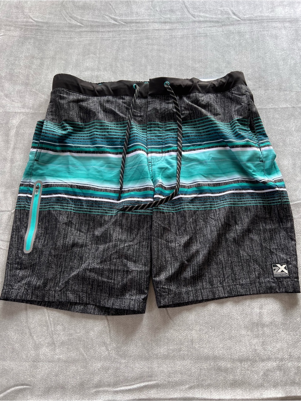 ZeroXposur Black and Teal Stripe Swim Trunks
